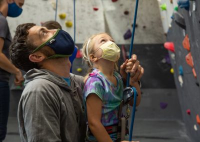 instructor showing child how to climb
