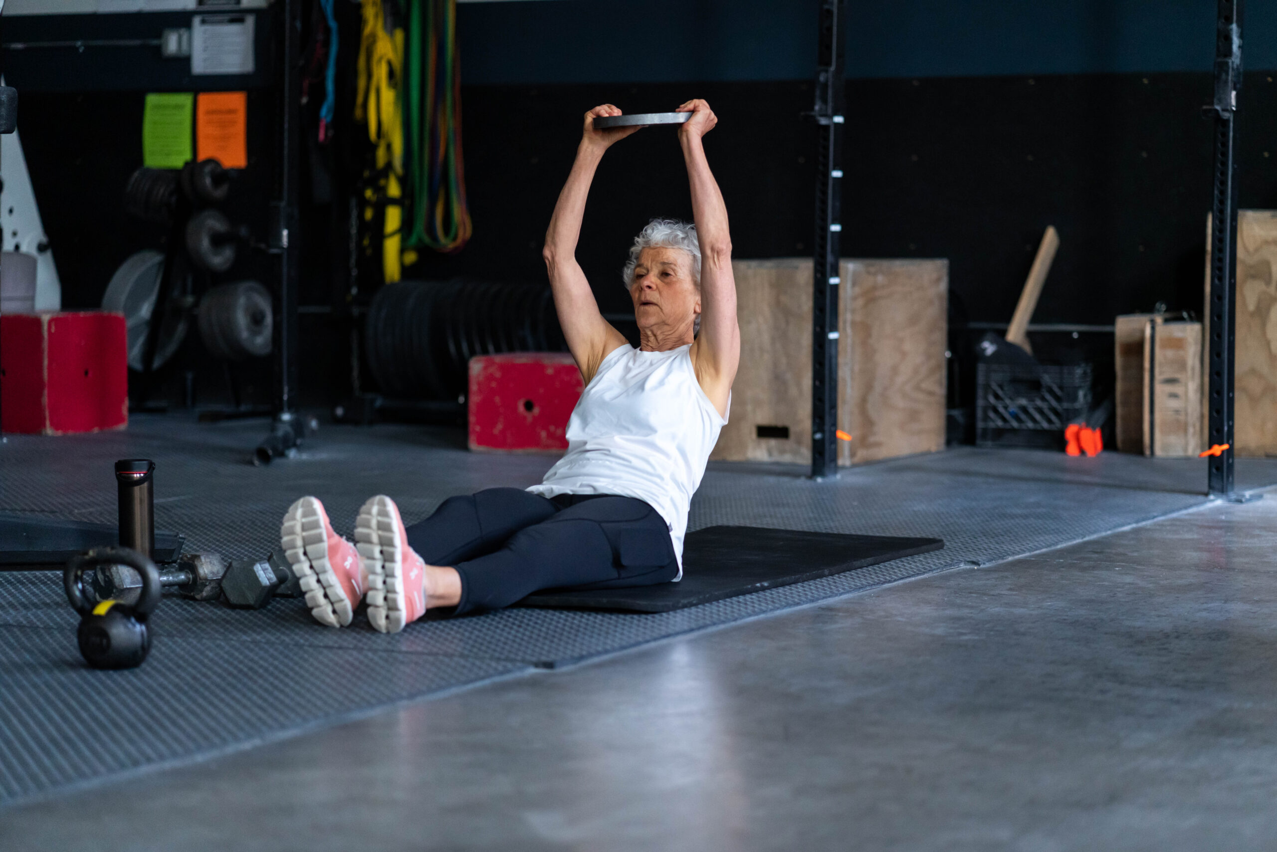 woman lifting ball over her head